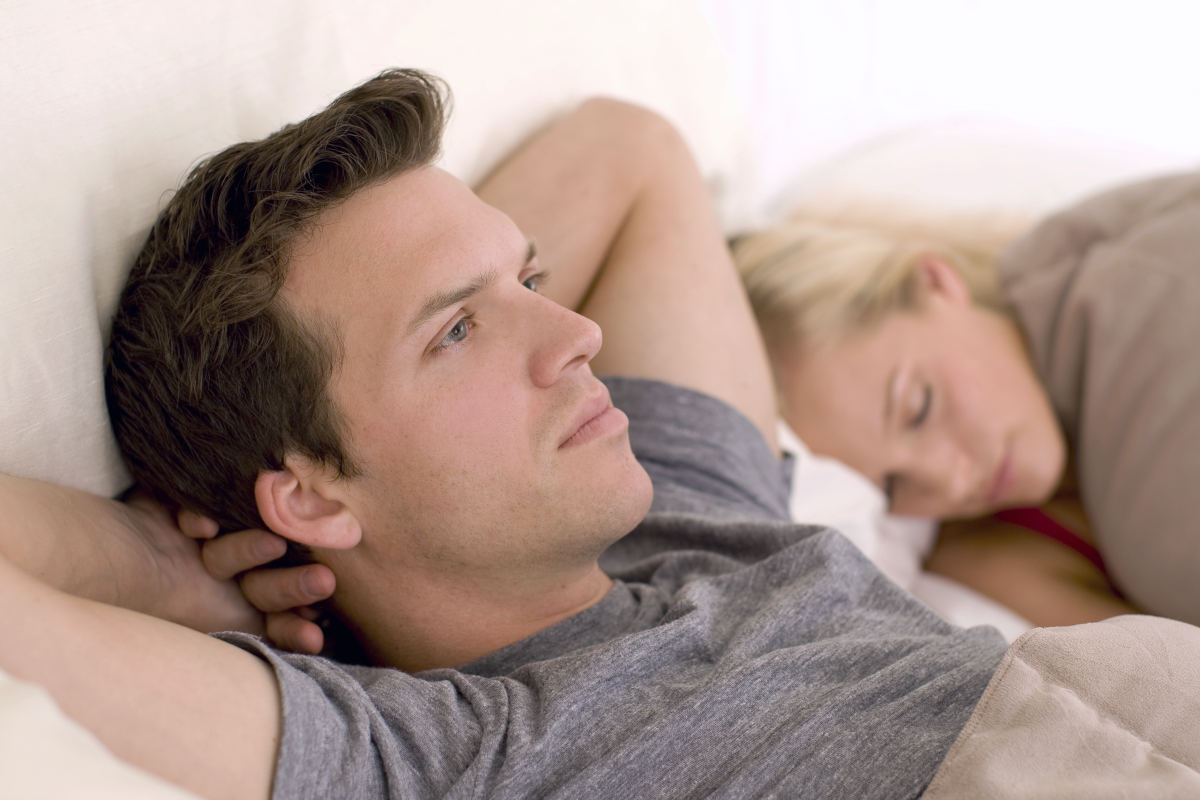 Couple in bed, man looking worried | What To Do When Viagra Doesn't Work | why viagra doesnt work